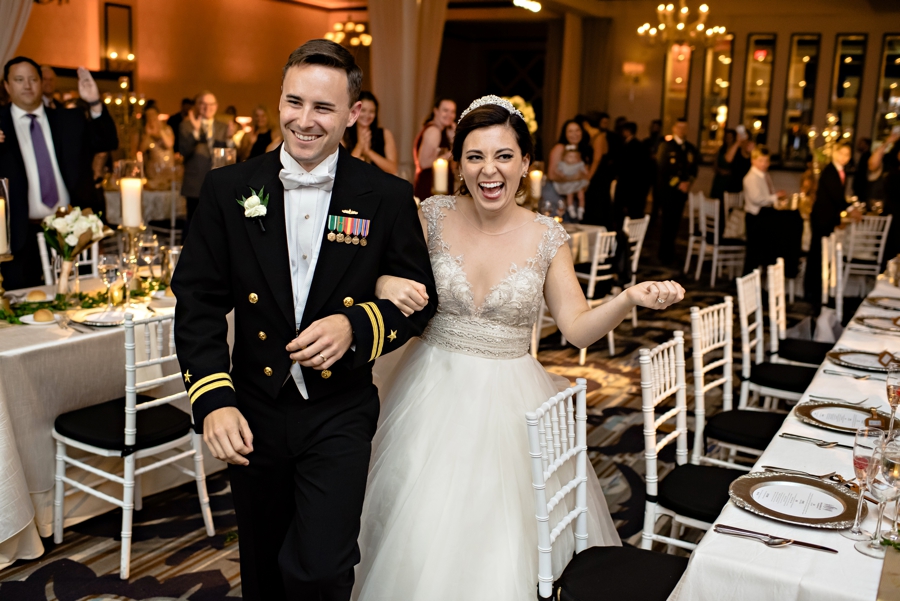 A wedding couple enter their wedding reception at Vie in Philadelphia.